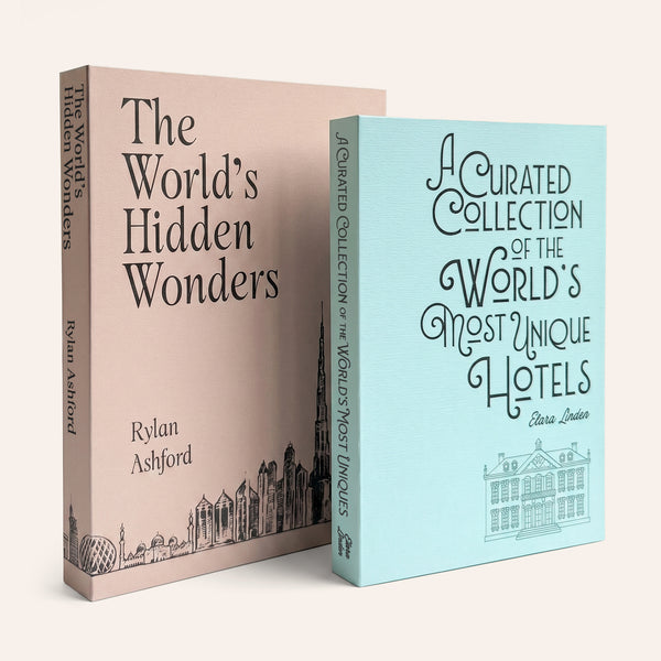 Two decorative storage books with travel-themed covers