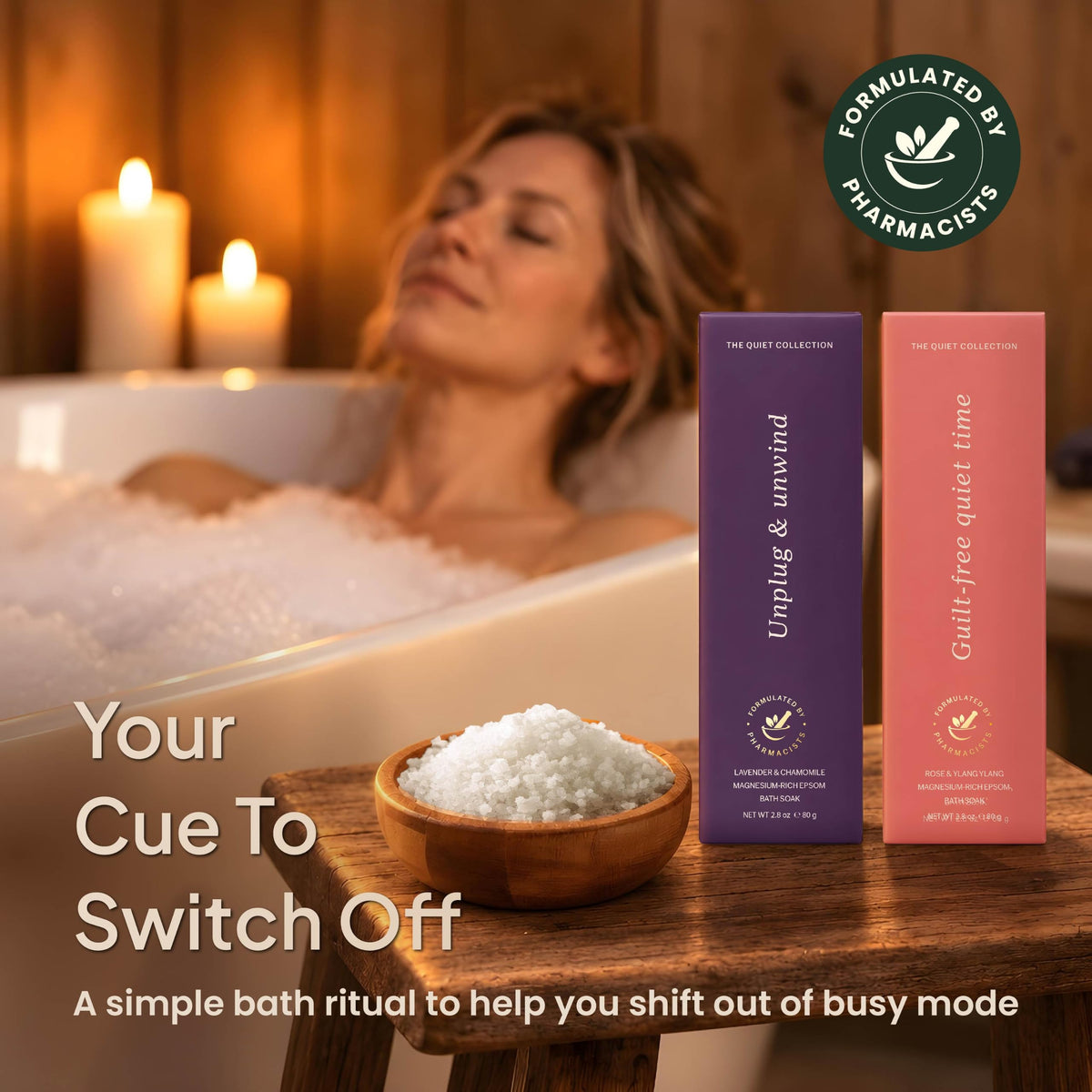 Woman relaxing in a candlelit bubble bath beside a bowl of bath salts and two bath soak boxes-2