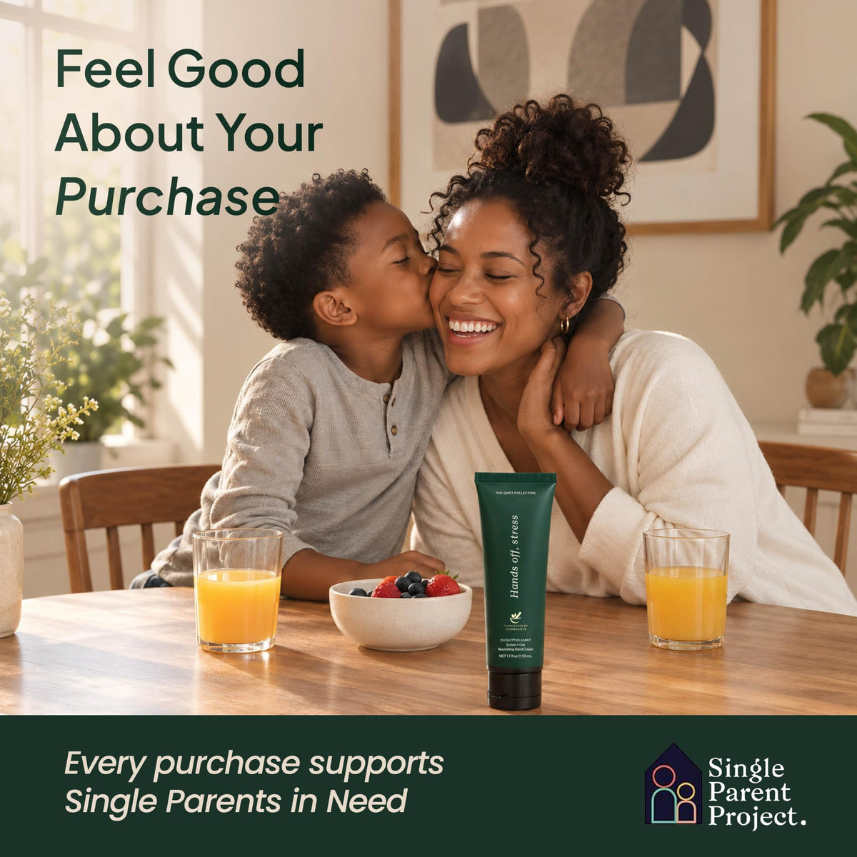 Mother being kissed by her son at breakfast with a eucalyptus hand cream tube; purchases support the Single Parent Project-