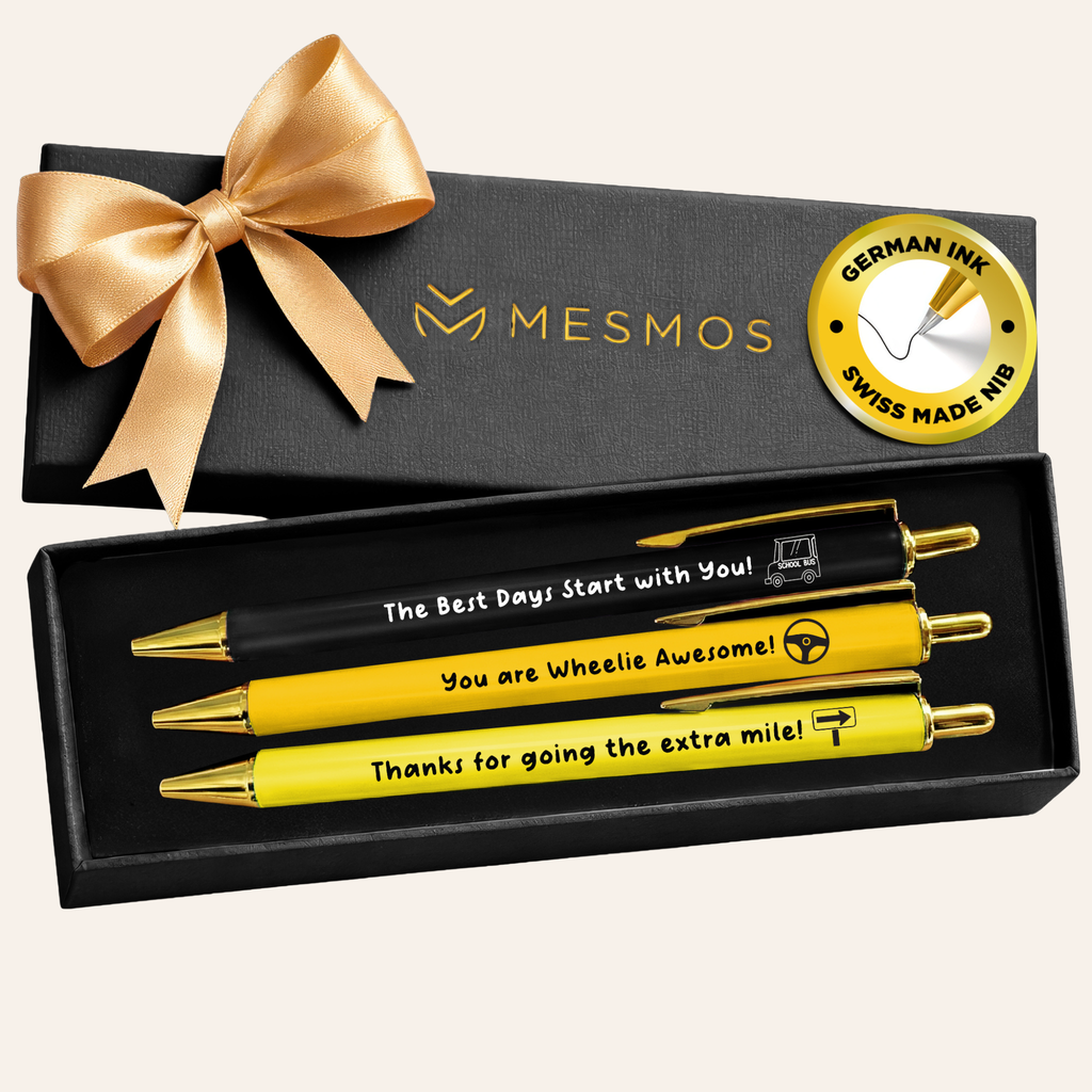 Set of yellow pens with gold accents in a black gift box with a MESMOS logo.